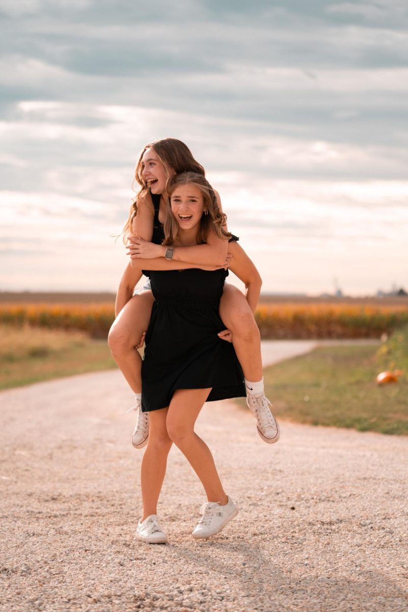 Addison Born (FR) and Lydia Collins (FR) in the midst of a fall photoshoot.